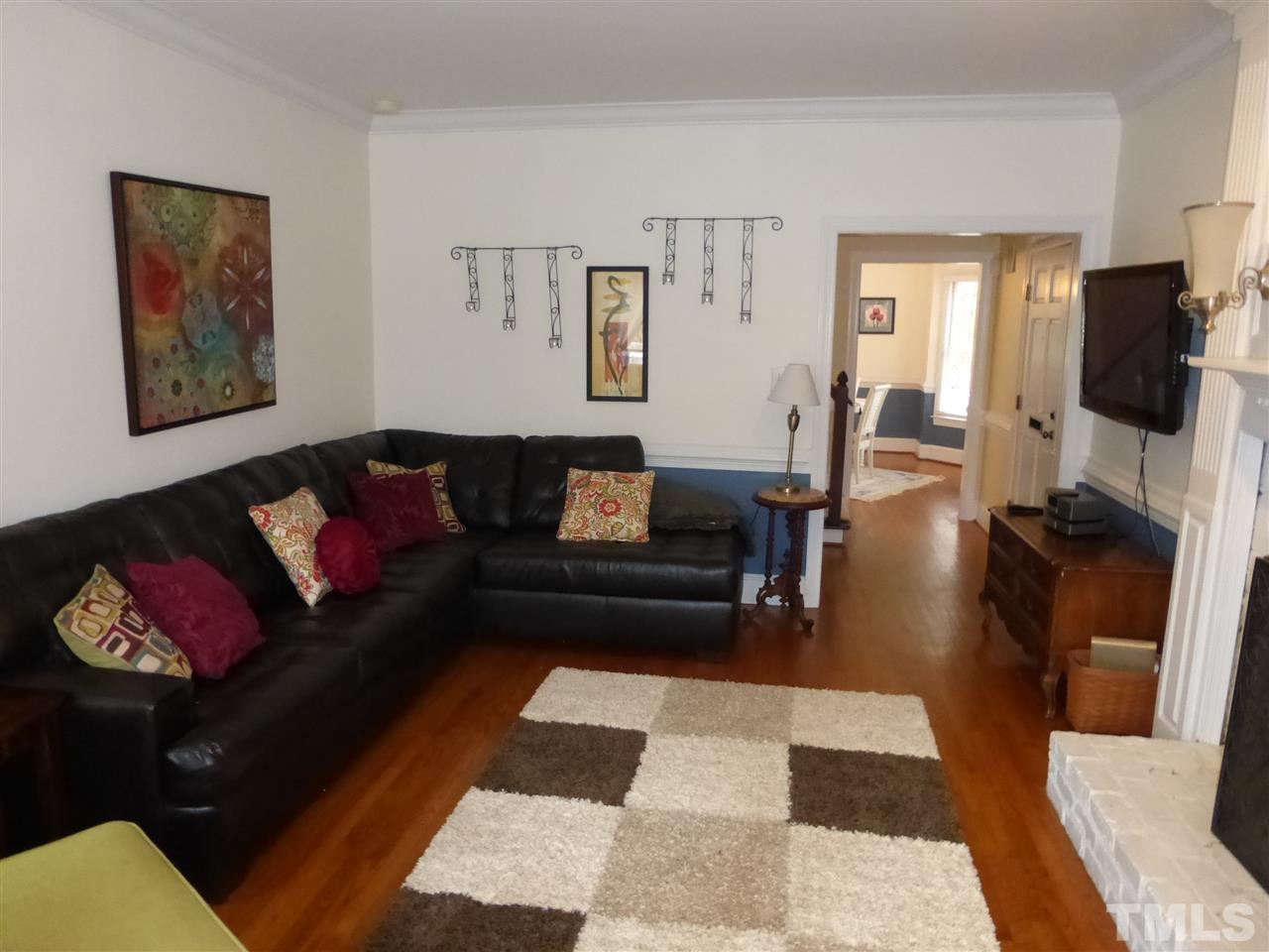 6846 Gloucester Road Raleigh, NC 27612 - Photo 9 of 18 a living room with furniture and wooden floor