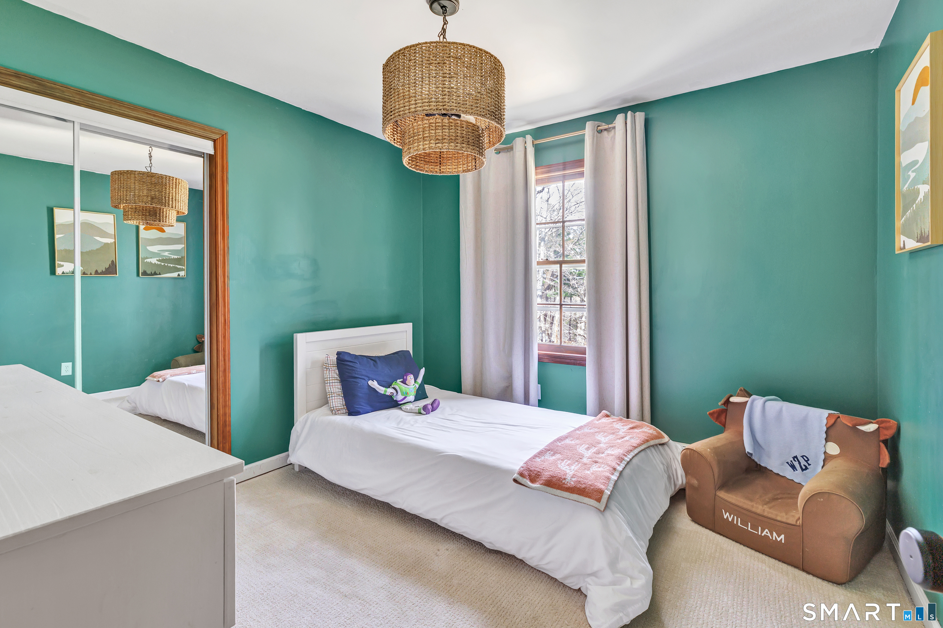 16 Mountain Road Wilton, CT 06897 - Photo 20 of 40 a bedroom with a bed mirror and window