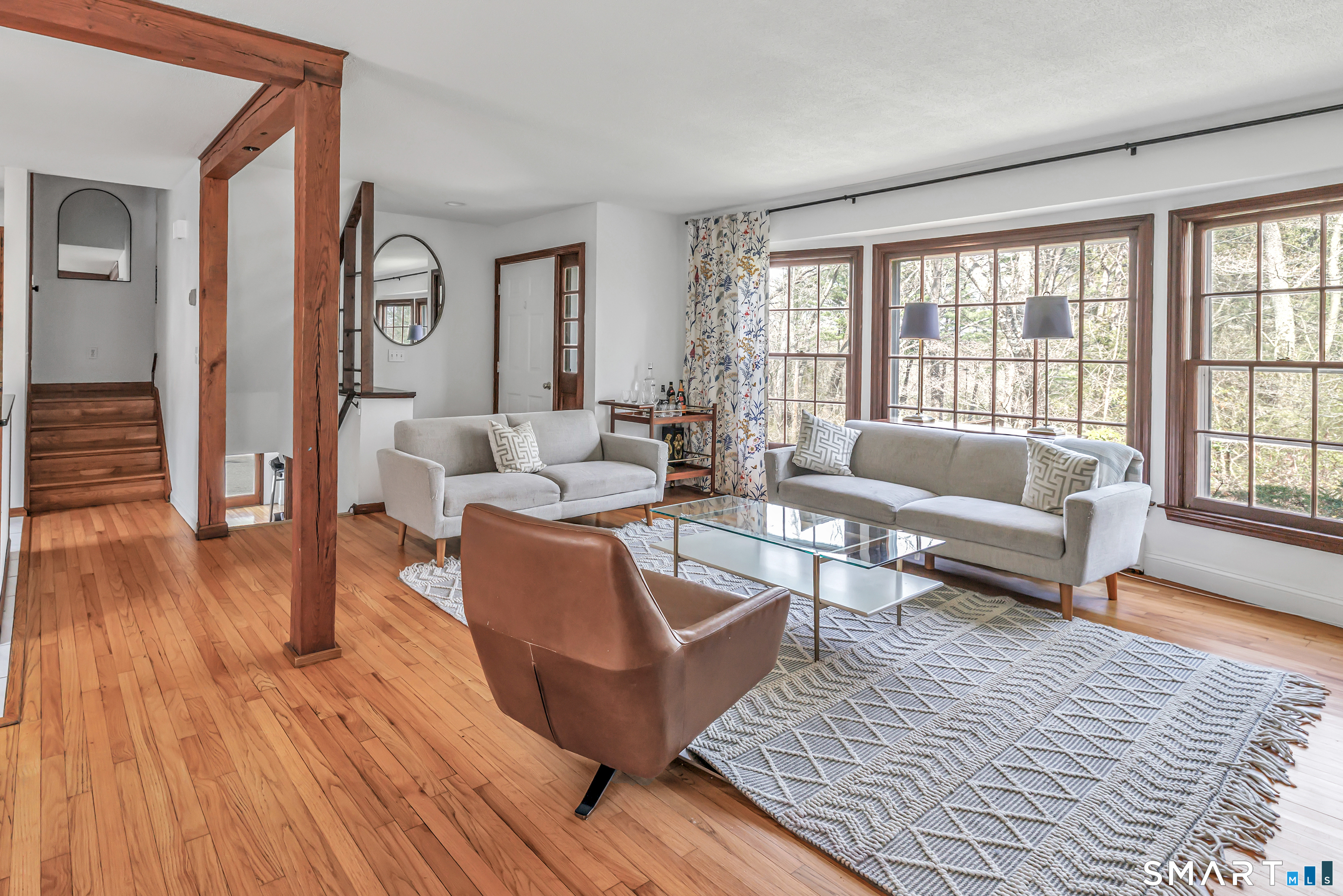 16 Mountain Road Wilton, CT 06897 - Photo 4 of 40 a living room with furniture and a large window