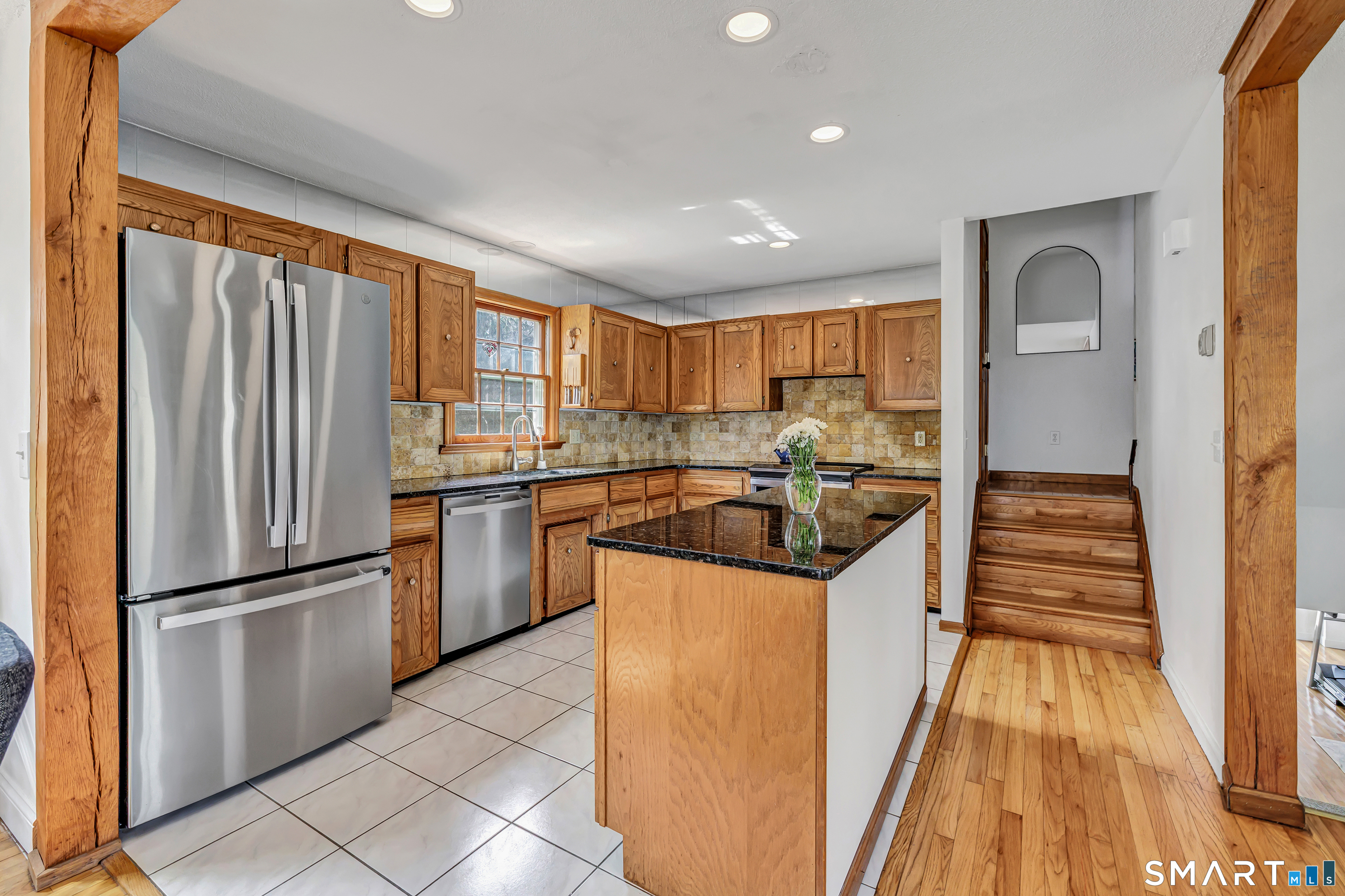 16 Mountain Road Wilton, CT 06897 - Photo 8 of 40 a kitchen with granite countertop stainless steel appliances a refrigerator stove top oven and sink