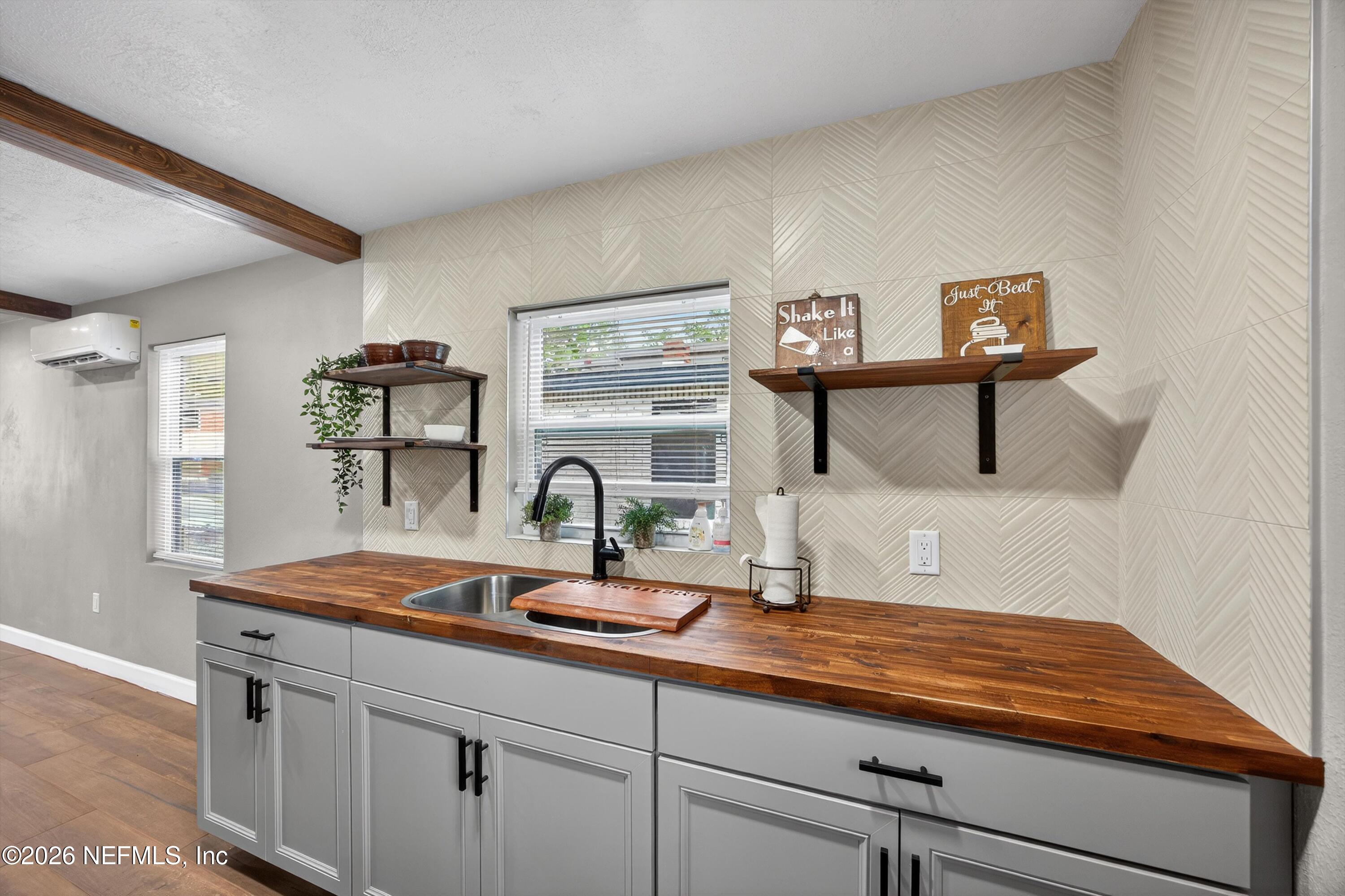 1741 Tyler Street Jacksonville, FL 32209 - Photo 12 of 25 a kitchen with sink and window