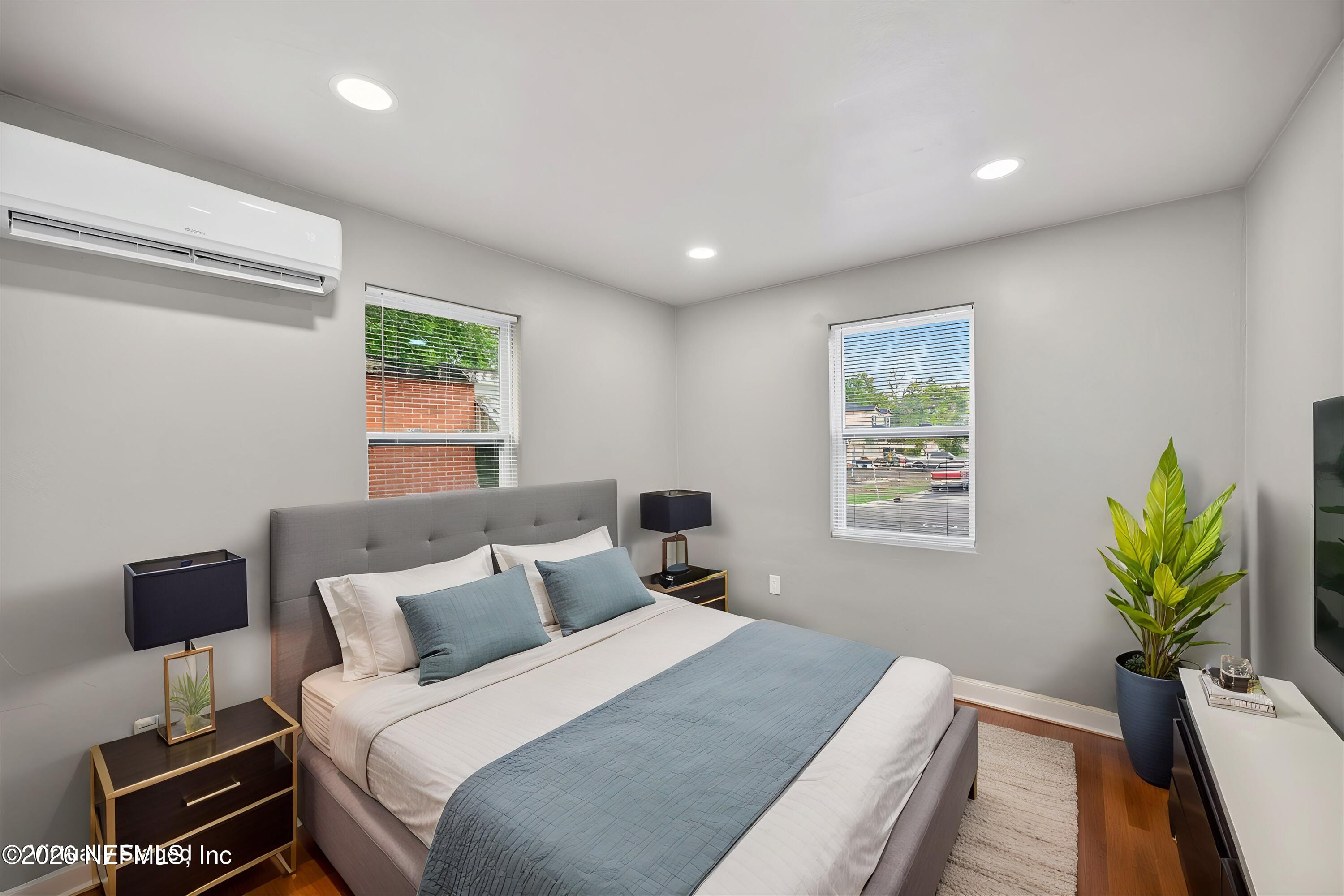 1741 Tyler Street Jacksonville, FL 32209 - Photo 13 of 25 a bedroom with a bed and a potted plant