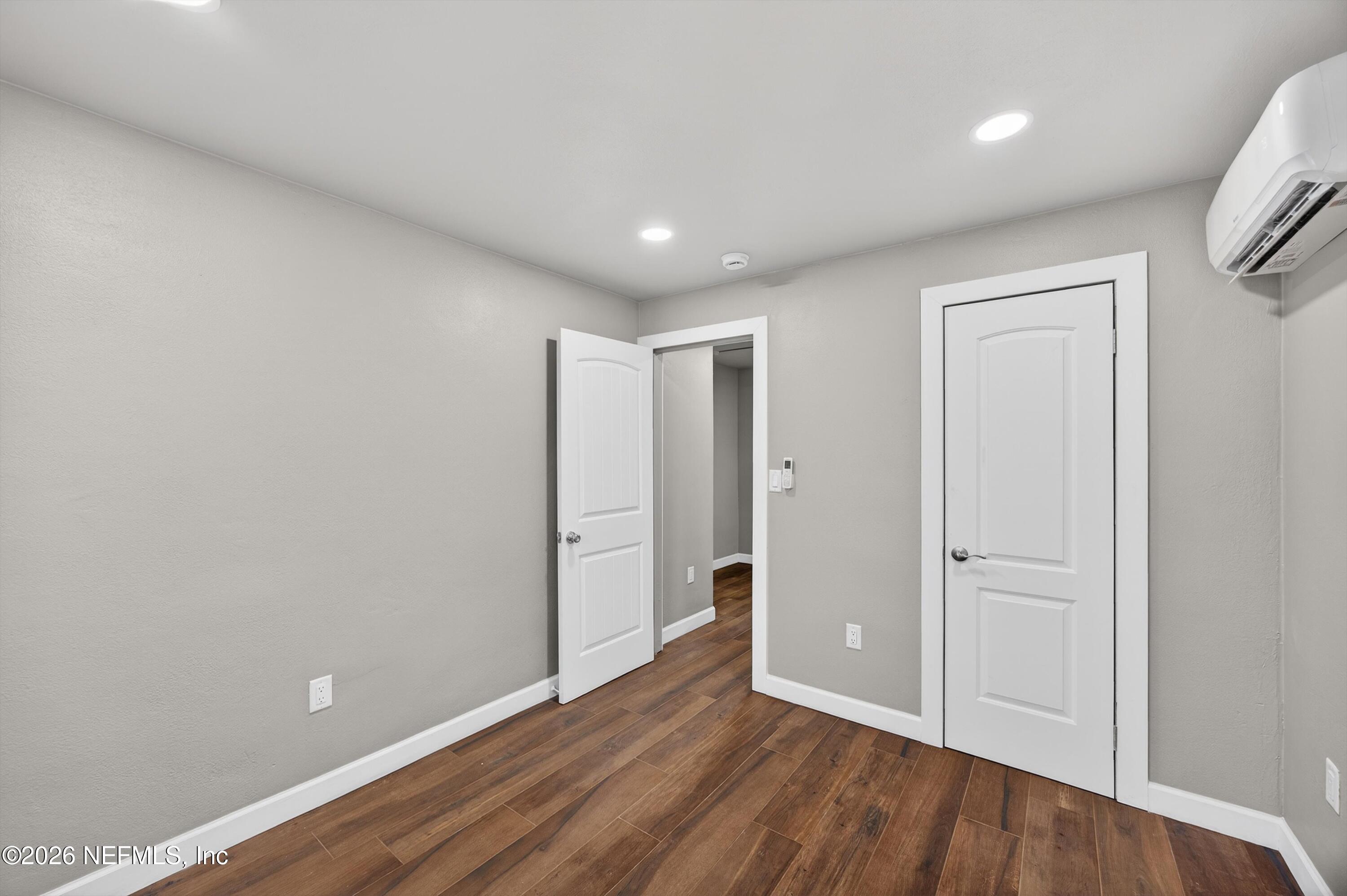 1741 Tyler Street Jacksonville, FL 32209 - Photo 16 of 25 a view of an empty room with wooden floor