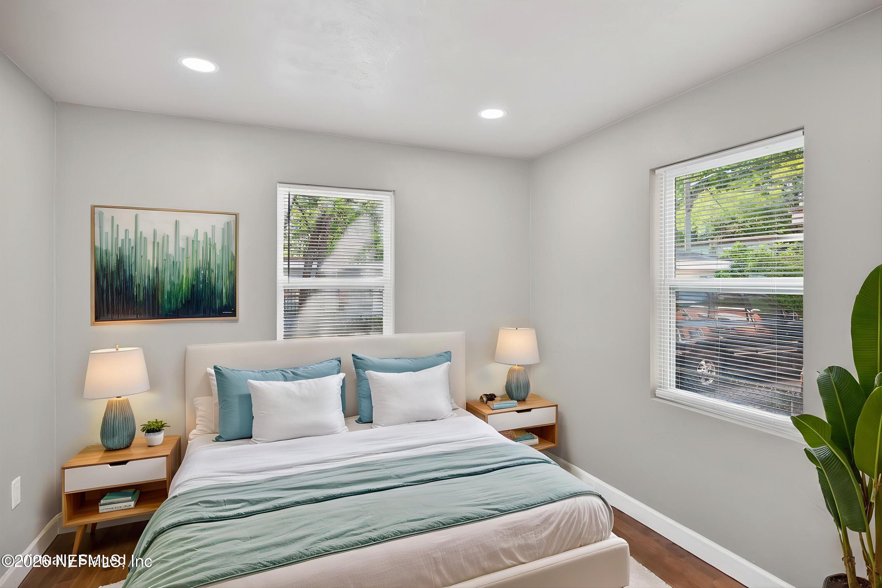 1741 Tyler Street Jacksonville, FL 32209 - Photo 19 of 25 a bedroom with a bed and wooden floor