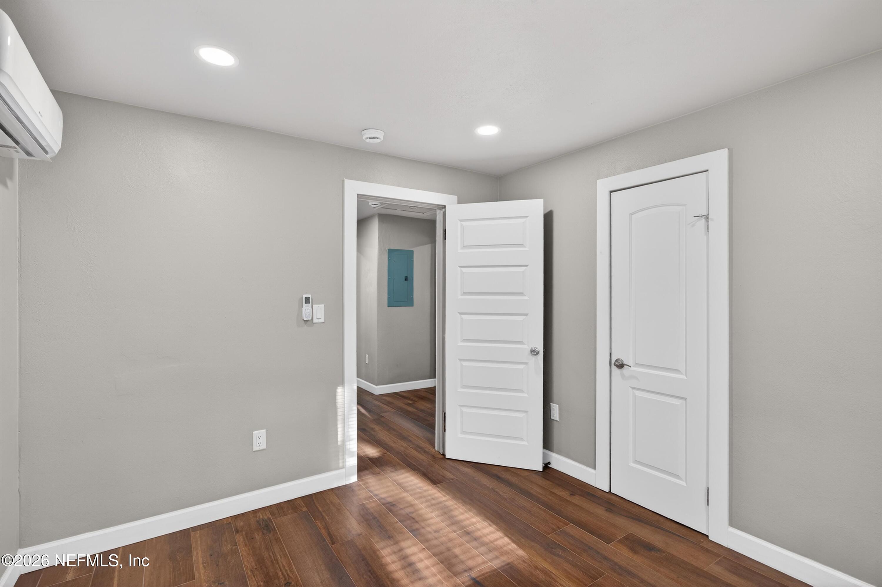 1741 Tyler Street Jacksonville, FL 32209 - Photo 22 of 25 an empty room with closet and wooden floor