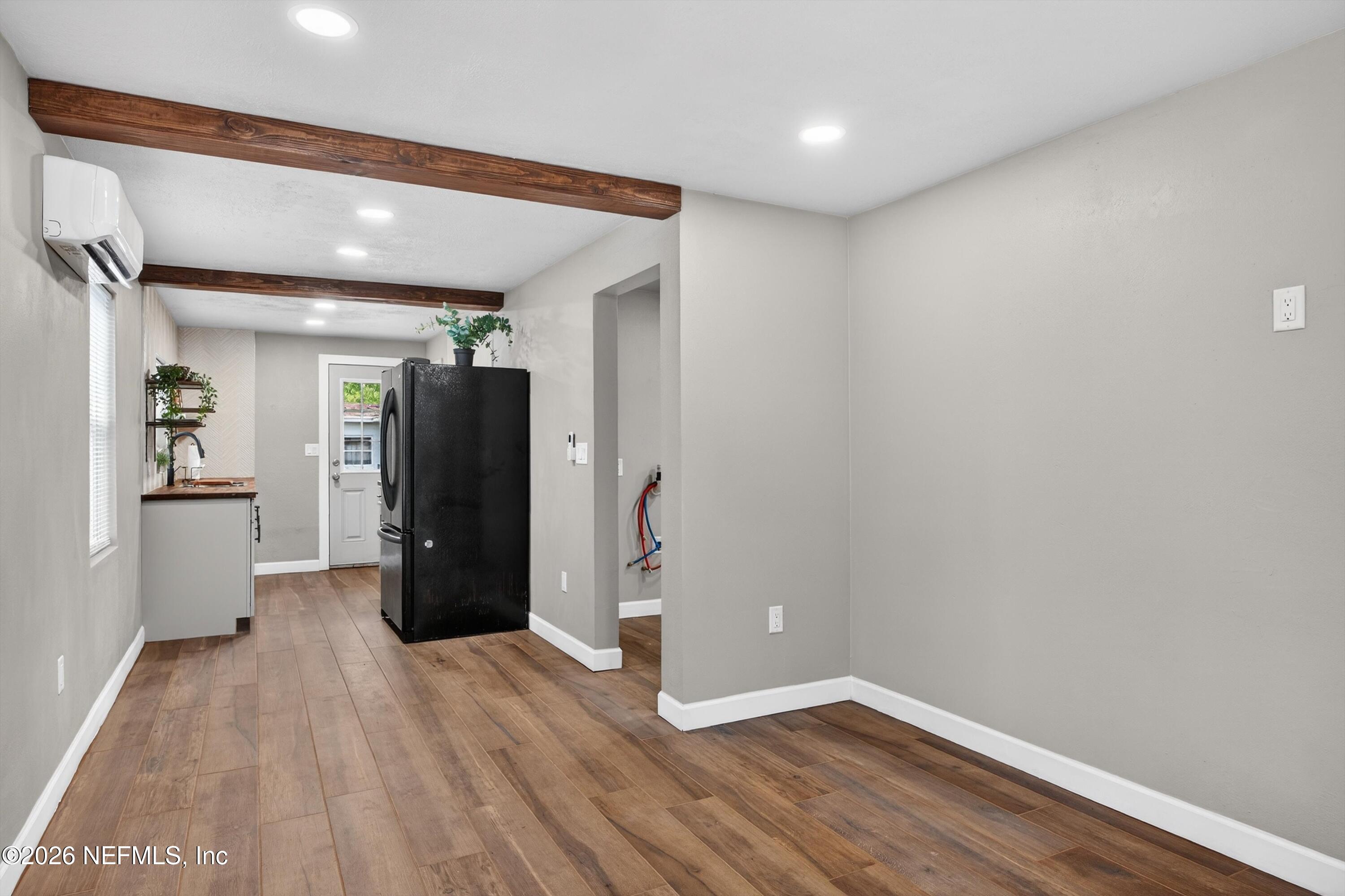 1741 Tyler Street Jacksonville, FL 32209 - Photo 8 of 25 a view of a hallway with wooden floor
