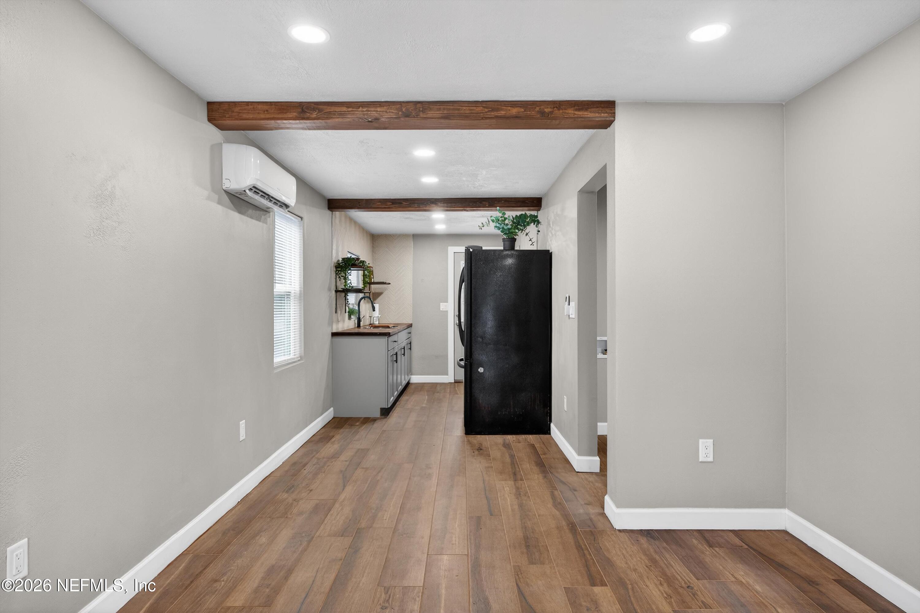 1741 Tyler Street Jacksonville, FL 32209 - Photo 9 of 25 a view of a hallway with wooden floor