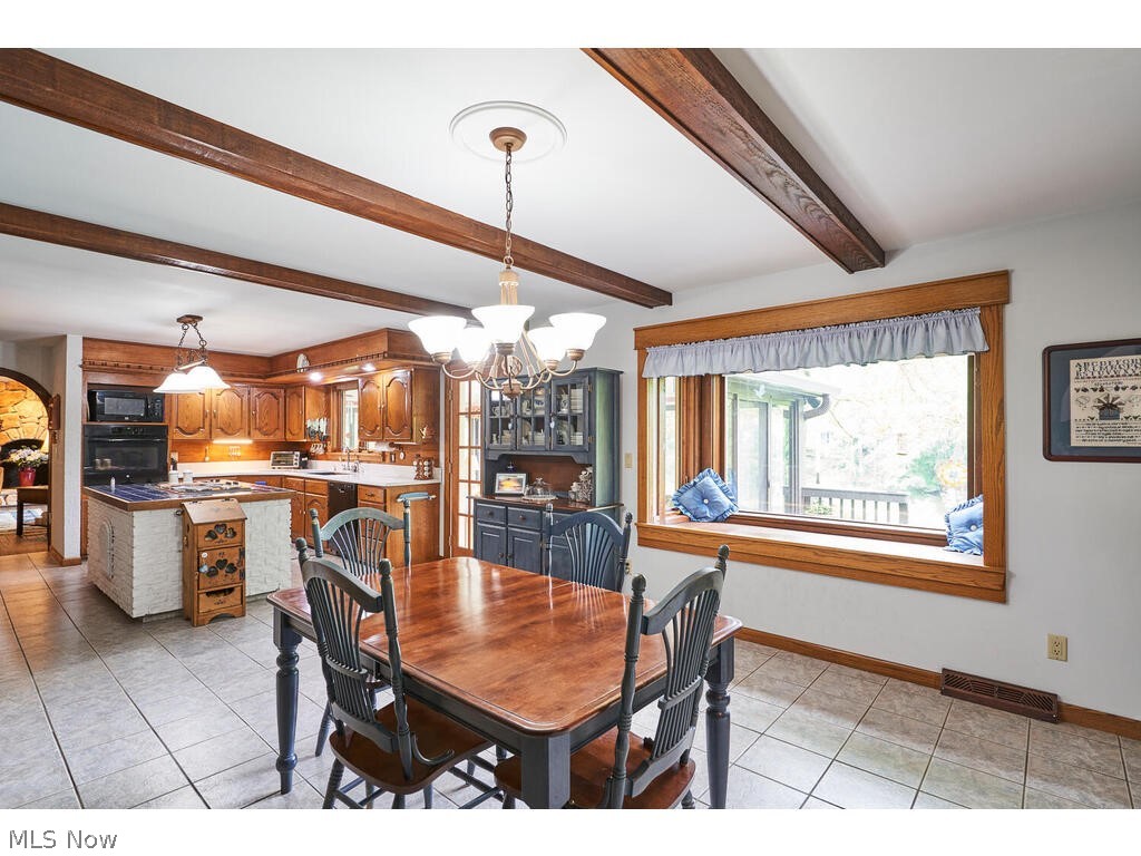 3376 West Bath Road Akron, OH 44333 - Photo 19 of 49 Eating area in Kitchen with large box window and a fireplace