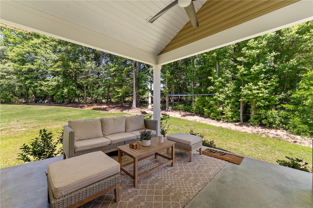 502 Canebrake Drive Anderson, SC 29621 - Photo 38 of 39 This inviting covered patio offers a serene outdoor retreat perfect for relaxing and enjoying the surroundings.