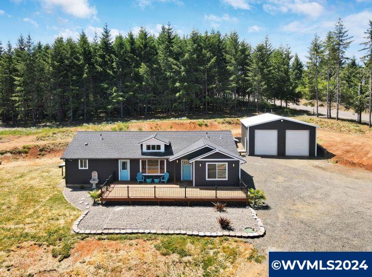 16480 Oakdale Road Dallas, OR 97338 - Photo 1 of 42 a front view of a house with a yard