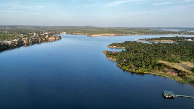 an aerial view of a house with a lake view