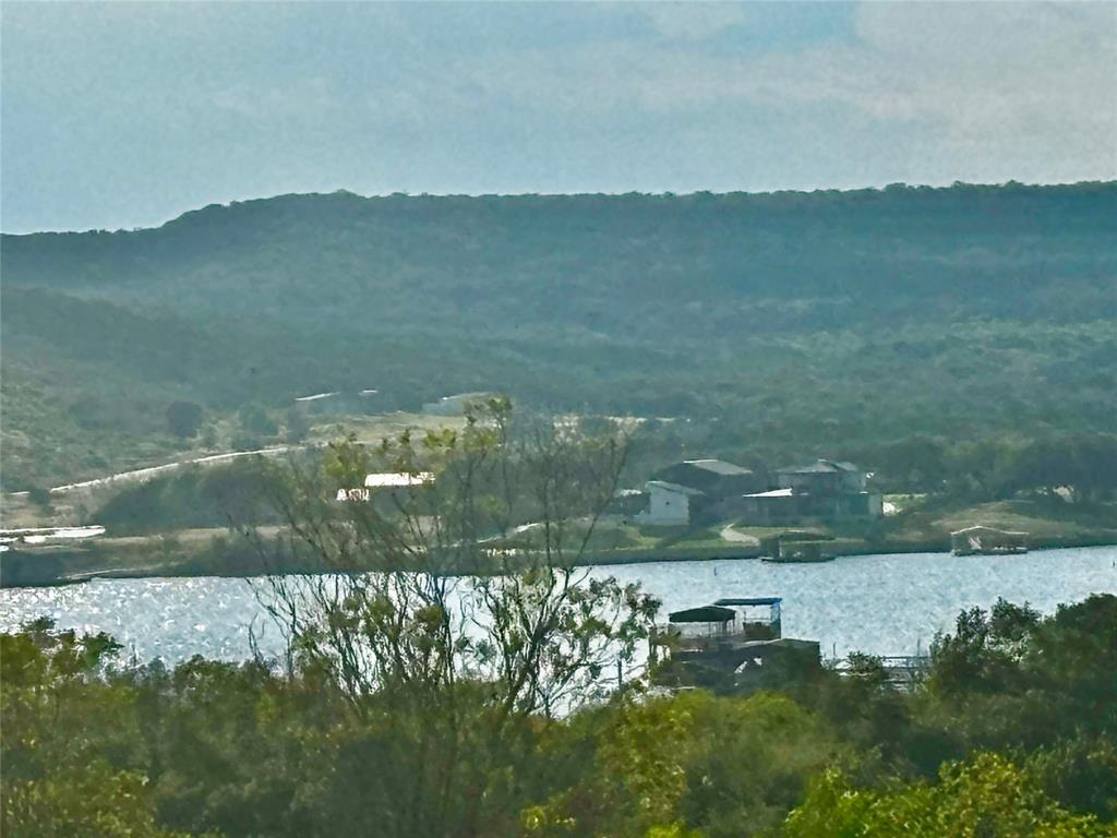 137 White Moon Road Graham, TX 76450 - Photo 8 of 15 a view of lake with mountain