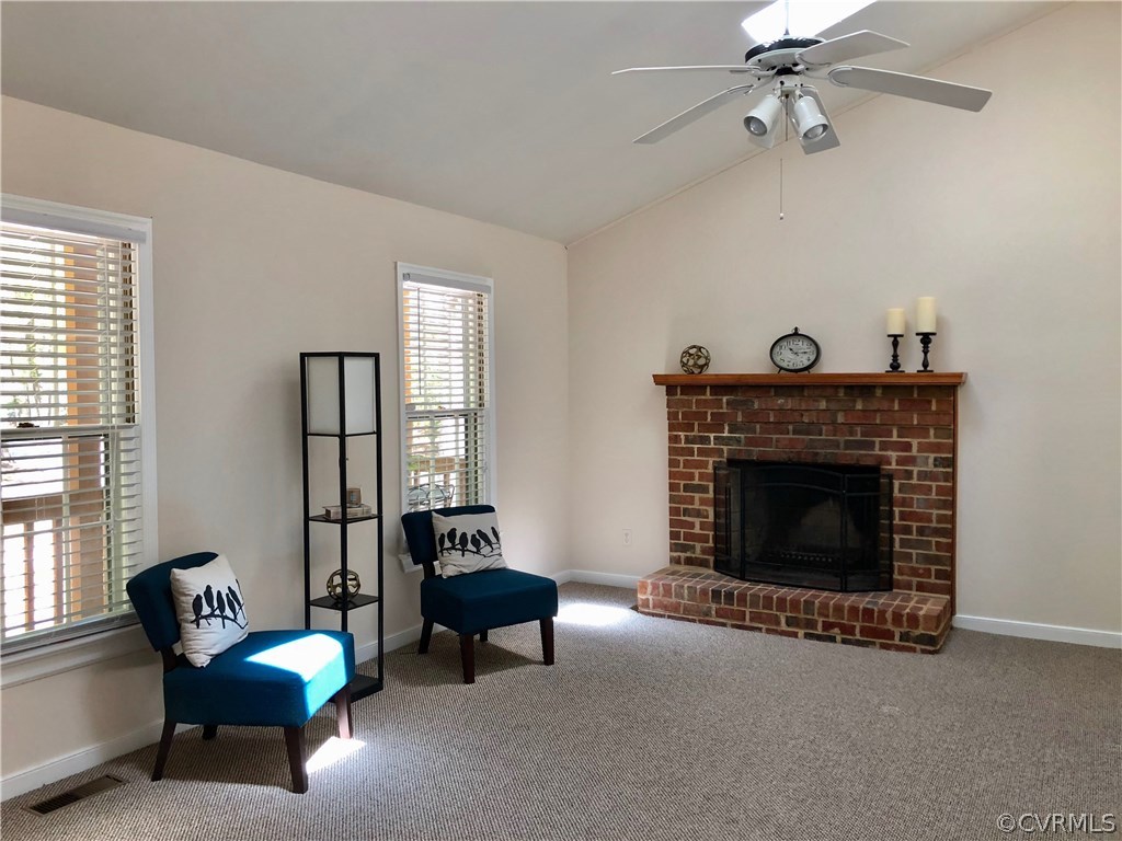 13331 Bailey Bridge Road Midlothian, VA 23112 - Photo 8 of 21 a living room with furniture and a fireplace