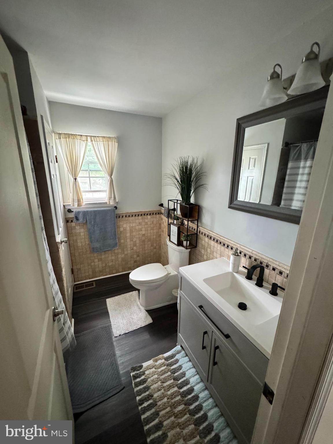 461 Old Erial Road Sicklerville, NJ 08081 - Photo 10 of 34 a spacious bathroom with a toilet sink and mirror