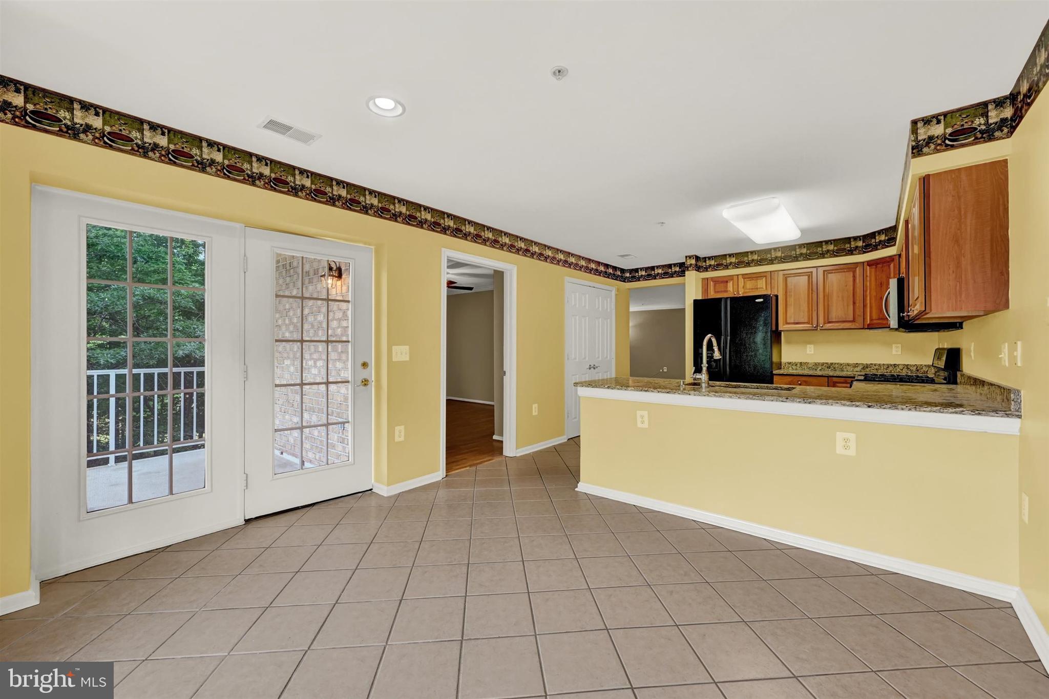12021 Tralee Road, Unit 402 Lutherville-Timonium, MD 21093 - Photo 19 of 36 Kitchen Table Area