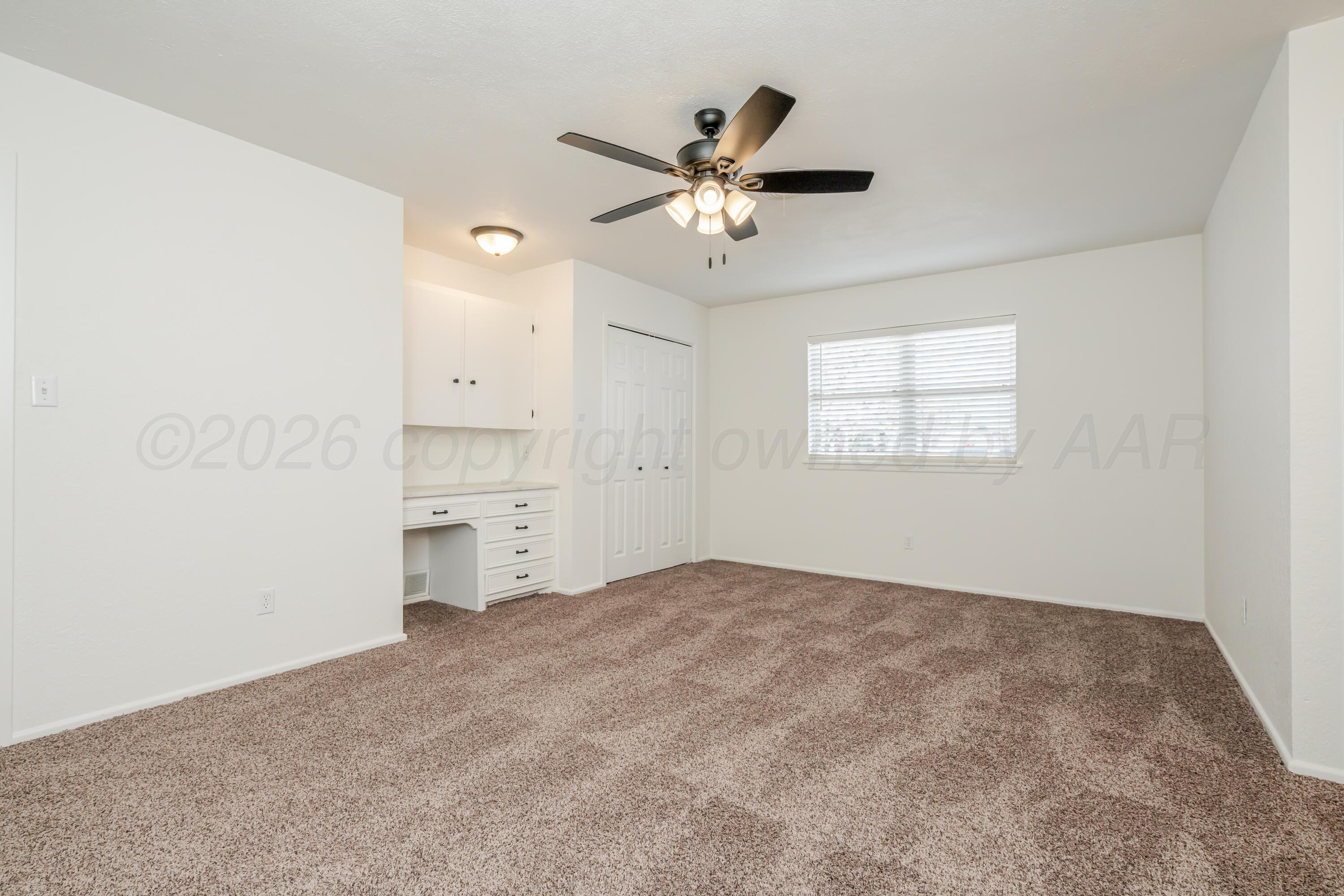 1001 5th Street Canyon, TX 79015 - Photo 19 of 34 a view of a livingroom with a ceiling fan and window