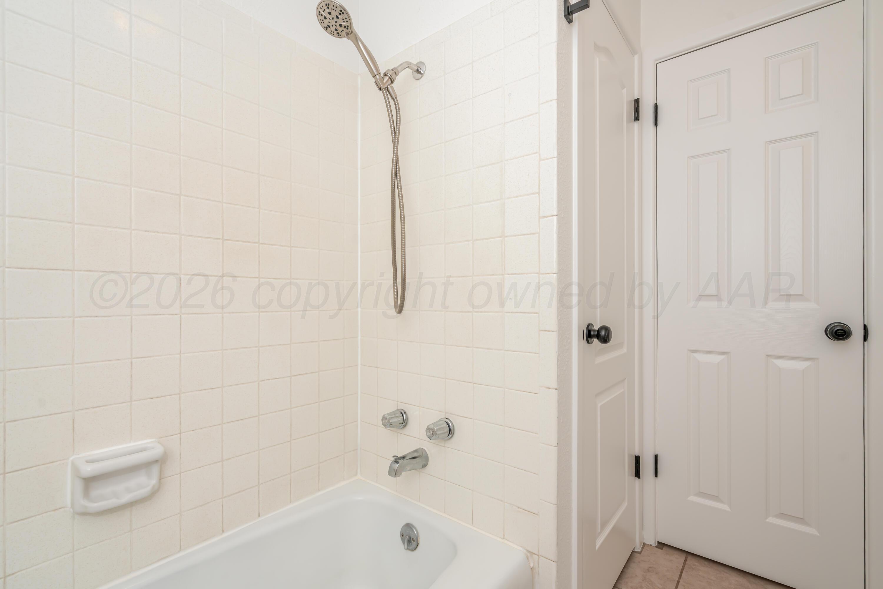 1001 5th Street Canyon, TX 79015 - Photo 28 of 34 a bathroom with a bathtub