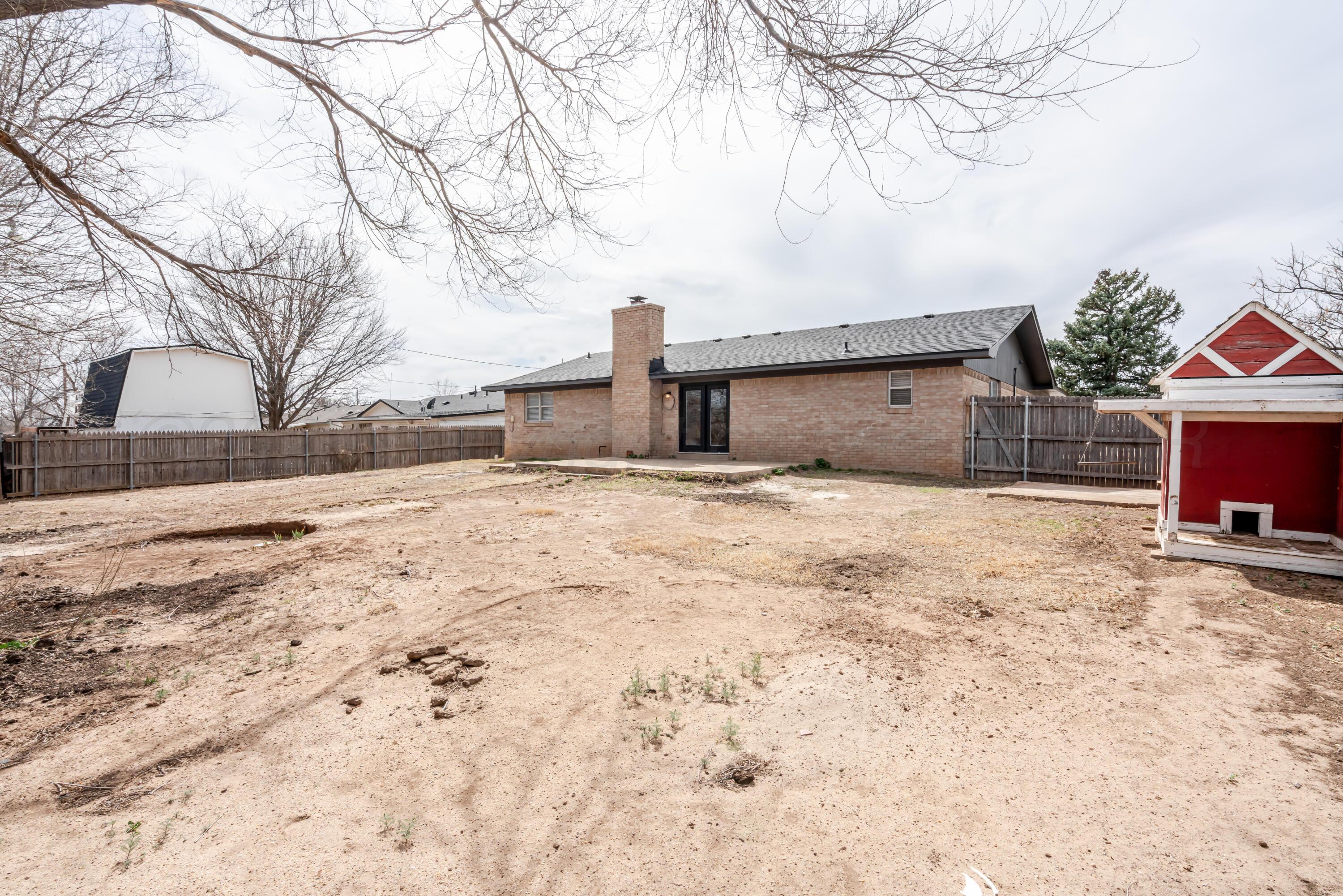 1001 5th Street Canyon, TX 79015 - Photo 34 of 34 a view of garage yard and tree