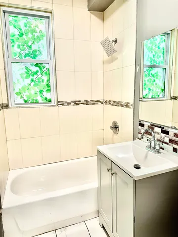a bathroom with a sink and a bathtub