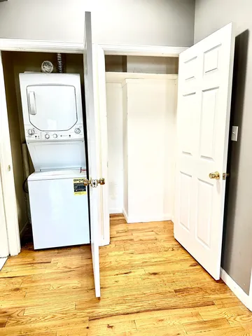a view of a bathroom with wooden floor and a sink