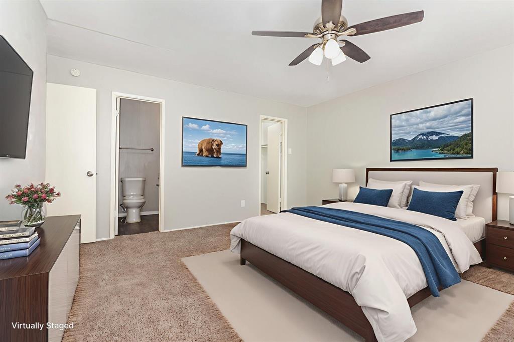 1108 Overdowns Drive Plano, TX 75023 - Photo 12 of 20 a bedroom with a large bed and a chandelier