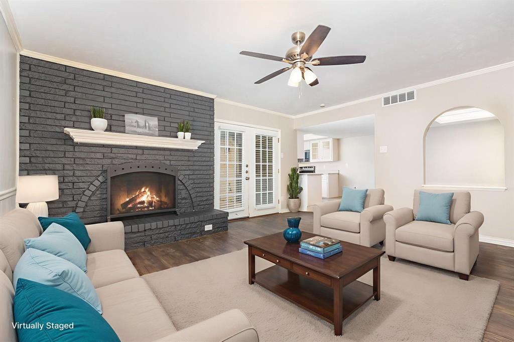 1108 Overdowns Drive Plano, TX 75023 - Photo 2 of 20 a living room with furniture and a fireplace