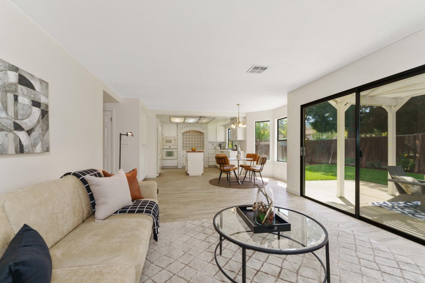 6702 Paseo Catalina Pleasanton, CA 94566 - Photo 14 of 44 a living room with furniture and a floor to ceiling window