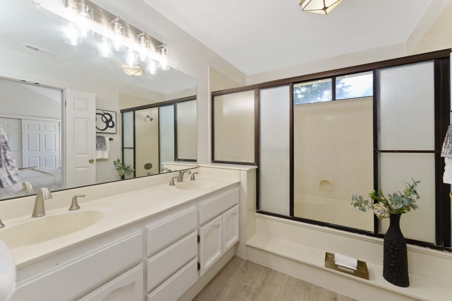 6702 Paseo Catalina Pleasanton, CA 94566 - Photo 27 of 44 a bathroom with a double vanity sink and a mirror