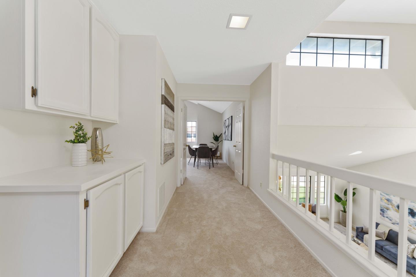 6702 Paseo Catalina Pleasanton, CA 94566 - Photo 28 of 44 a hallway with a white cabinets