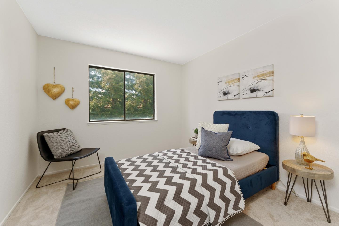 6702 Paseo Catalina Pleasanton, CA 94566 - Photo 34 of 44 a bedroom with a bed and chair