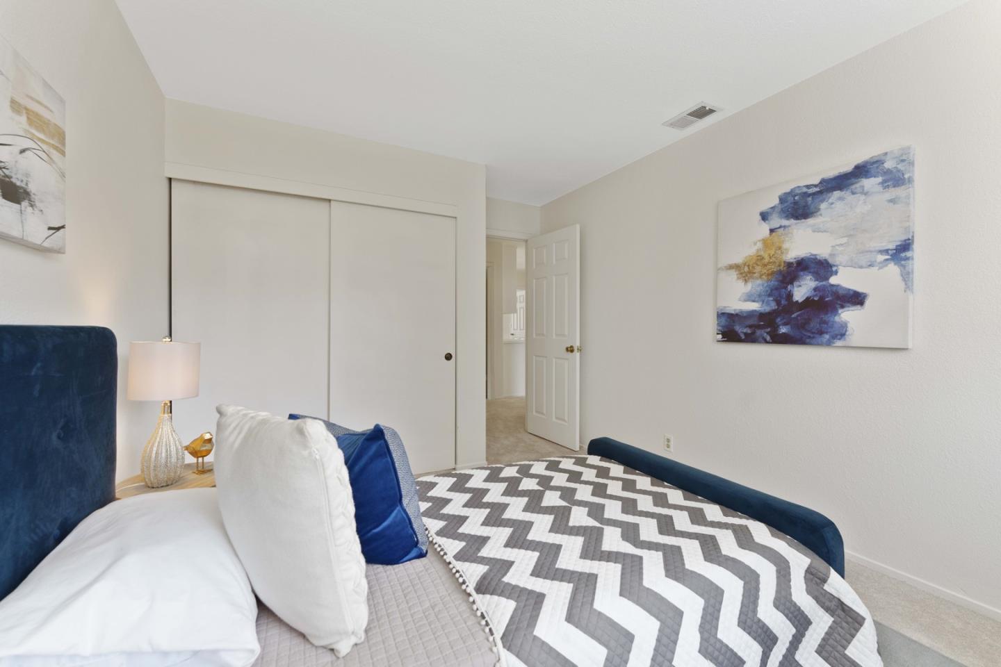 6702 Paseo Catalina Pleasanton, CA 94566 - Photo 35 of 44 a bedroom with a bed and a painting on the wall