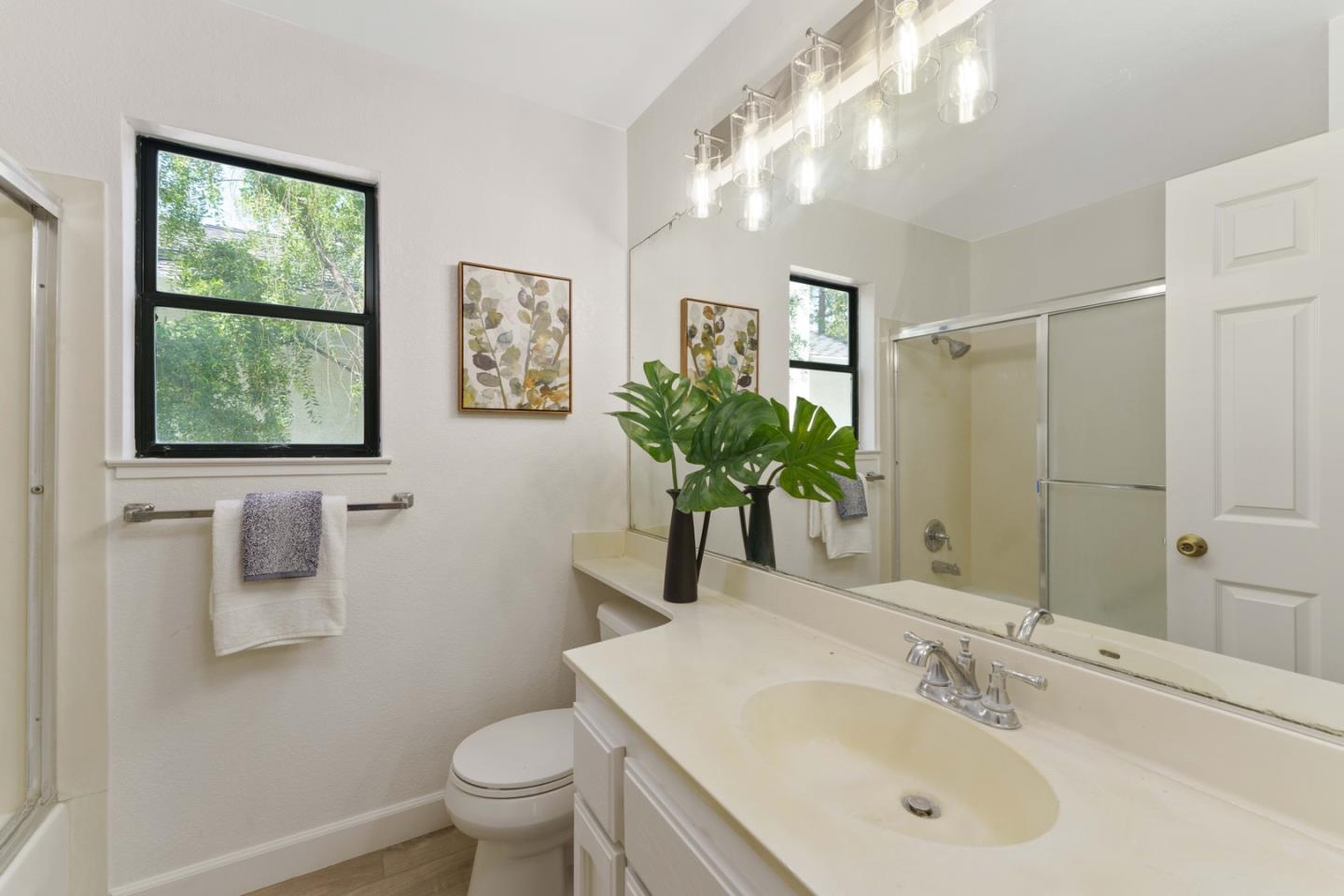 6702 Paseo Catalina Pleasanton, CA 94566 - Photo 36 of 44 a bathroom with a sink toilet and large mirror