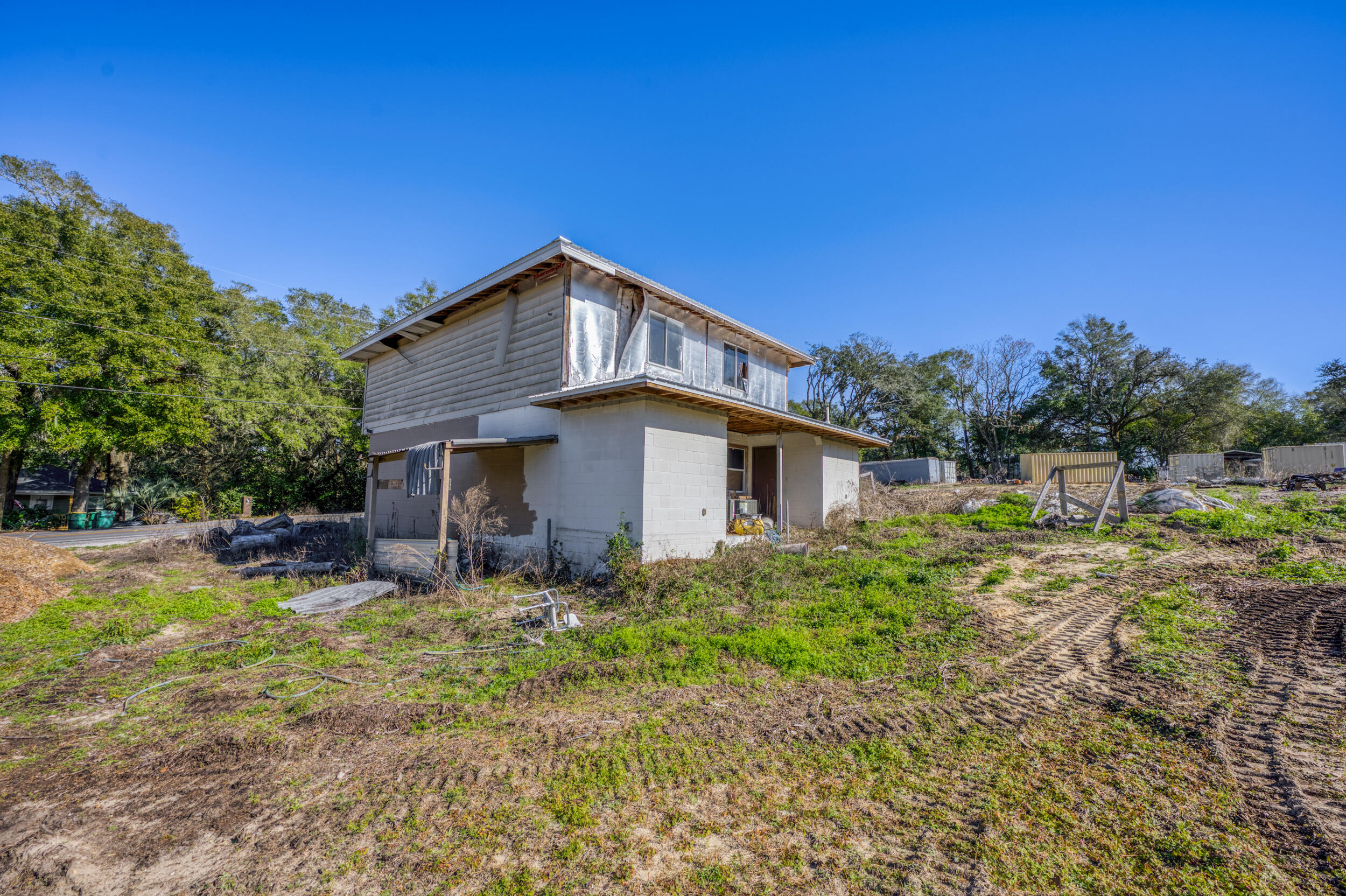 311 Kelly Road Niceville, FL 32578 - Photo 7 of 13 a house with trees in the background