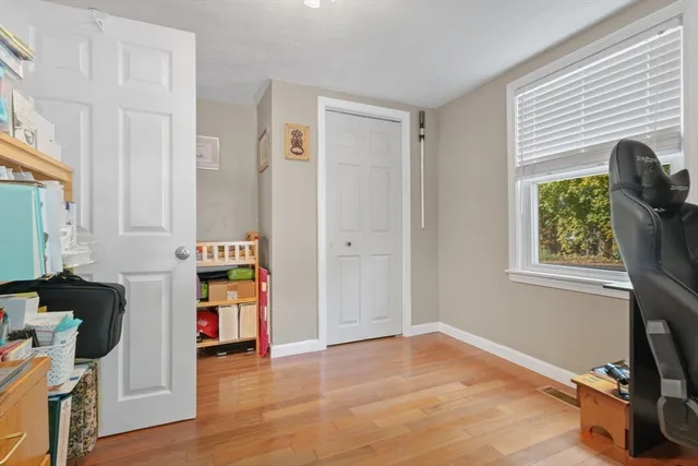a view of a livingroom with furniture and a window