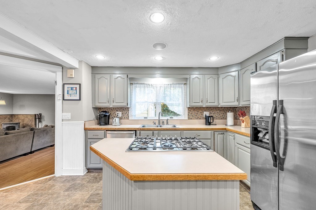 12 Munn Road Monson, MA 01057 - Photo 11 of 40 a large kitchen with kitchen island a large counter top space stainless steel appliances and cabinets
