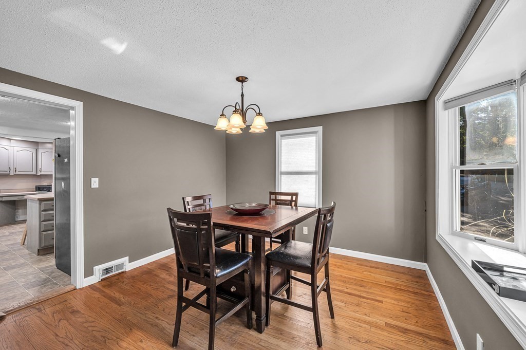 12 Munn Road Monson, MA 01057 - Photo 13 of 40 a view of a dining room with furniture window and wooden floor