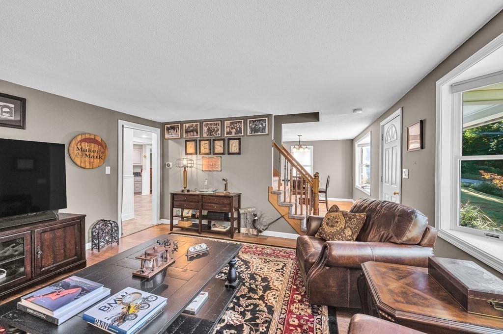 12 Munn Road Monson, MA 01057 - Photo 17 of 40 a living room with furniture and a flat screen tv with wooden floor