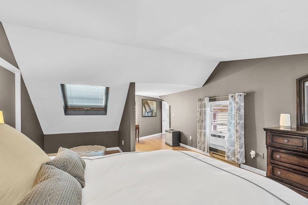 12 Munn Road Monson, MA 01057 - Photo 30 of 40 a bedroom with a bed and wooden floor