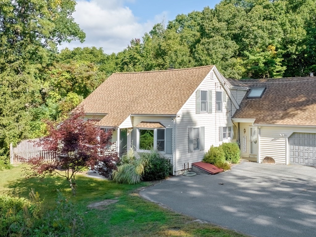 12 Munn Road Monson, MA 01057 - Photo 3 of 40 a view of a house with a yard and potted plants