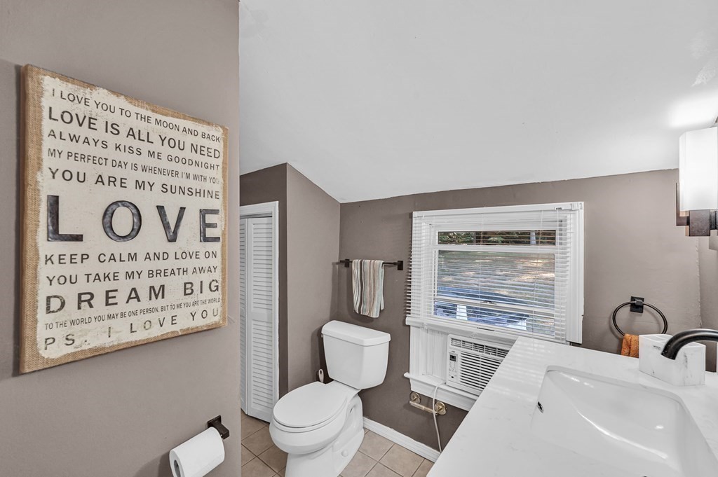 12 Munn Road Monson, MA 01057 - Photo 31 of 40 a bathroom with a toilet sink and a mirror