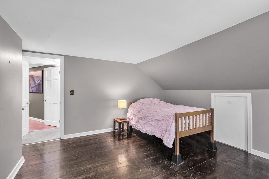 12 Munn Road Monson, MA 01057 - Photo 36 of 40 a room with a bed and wooden floor