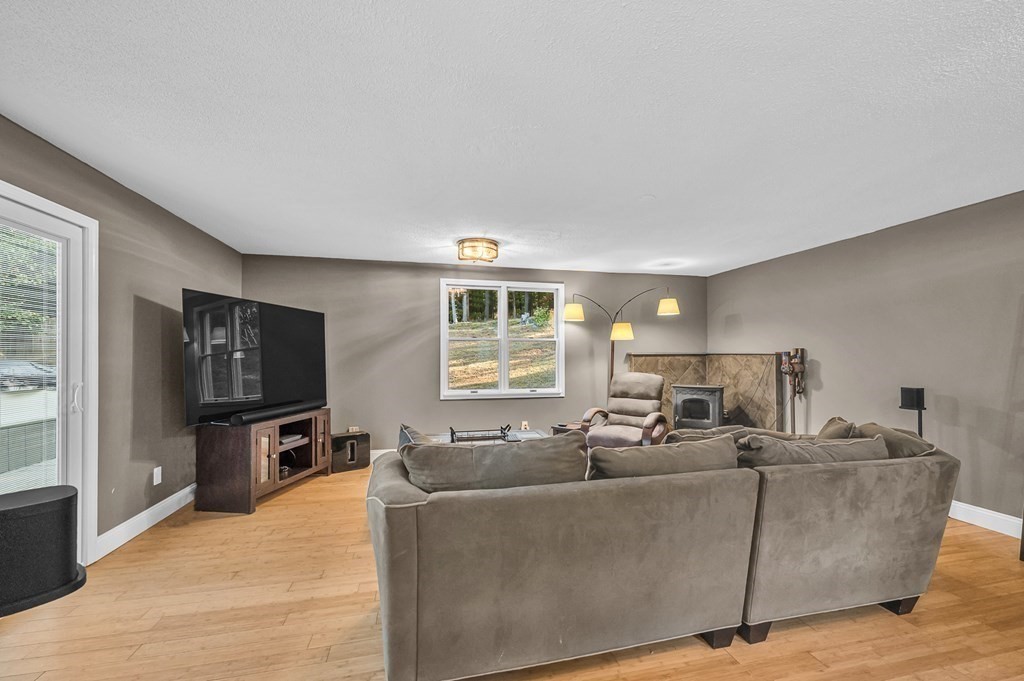 12 Munn Road Monson, MA 01057 - Photo 5 of 40 a living room with furniture and a flat screen tv