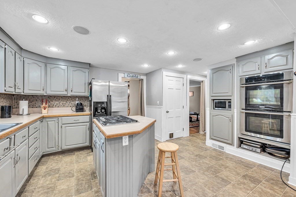12 Munn Road Monson, MA 01057 - Photo 8 of 40 a kitchen with a sink stove and refrigerator