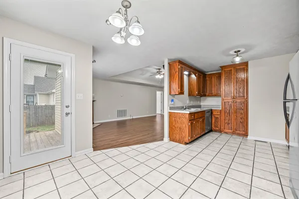 a kitchen with stainless steel appliances a sink and a refrigerator