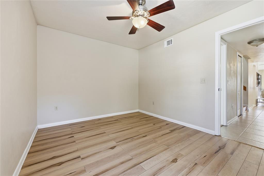 4427 Southwest 21st Lane Gainesville, FL 32607 - Photo 18 of 36 wooden floor in an empty room