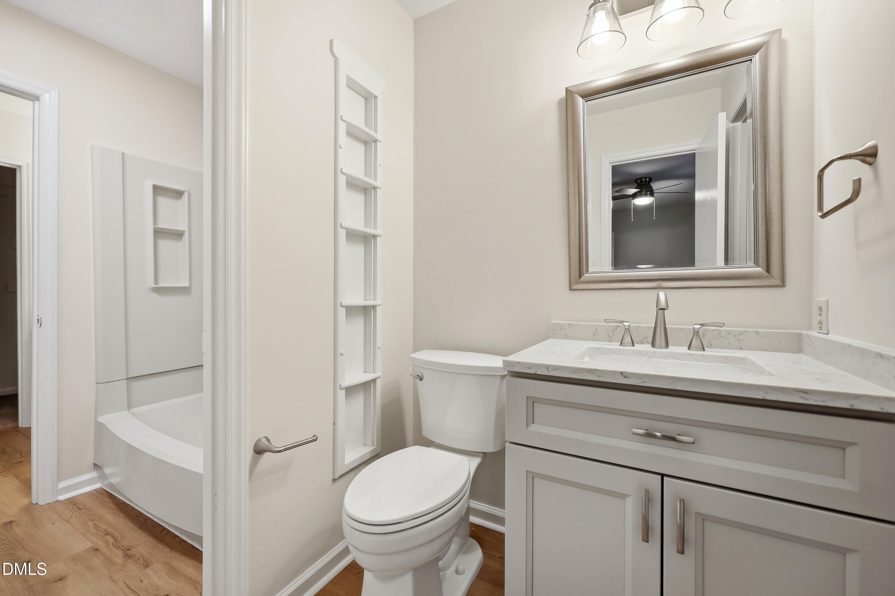 669 Bashford Road Raleigh, NC 27606 - Photo 9 of 19 a bathroom with a sink toilet and shower