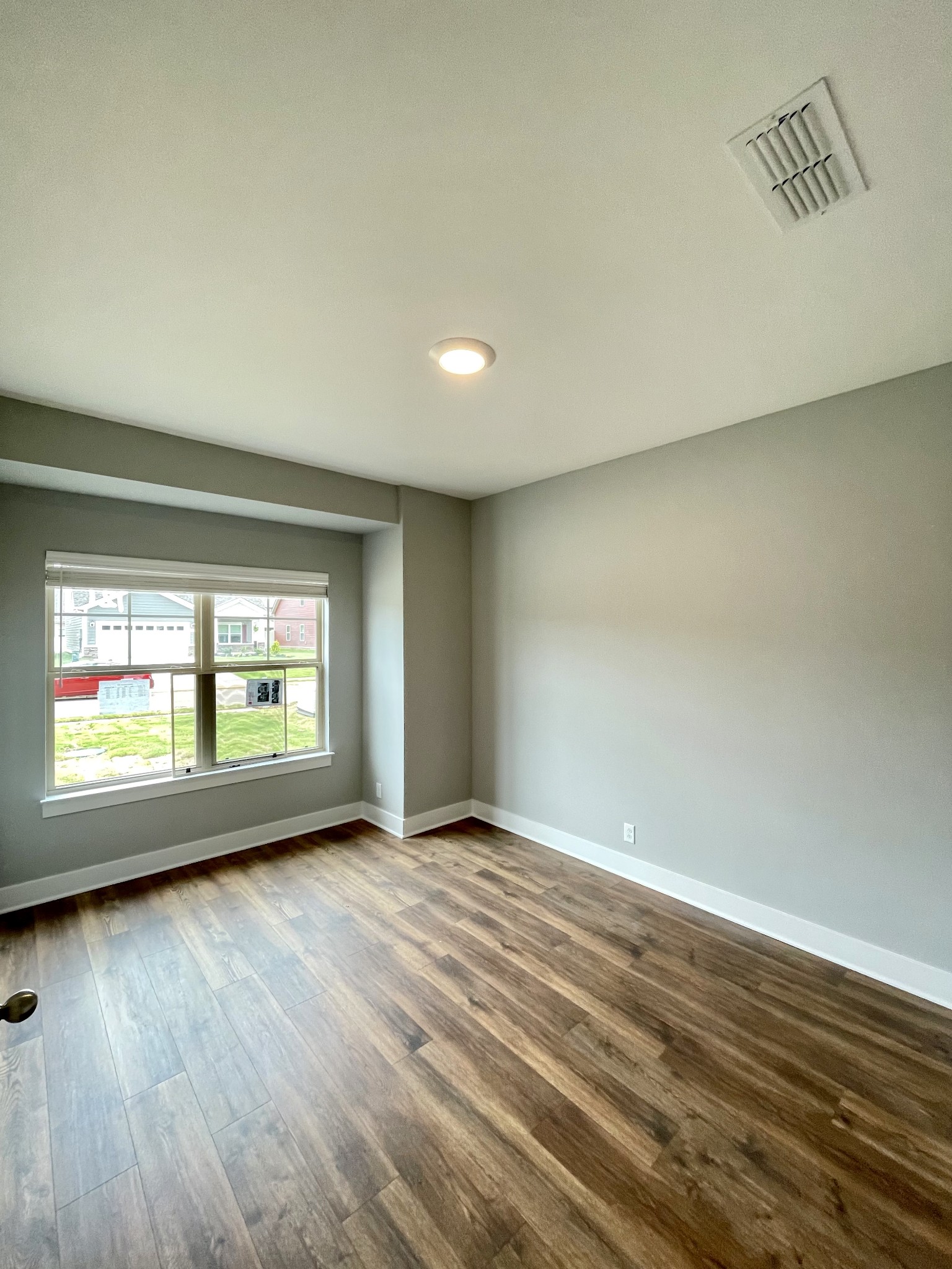 2423 Fig Drive Murfreesboro, TN 37127 - Photo 3 of 37 an empty room with wooden floor and windows