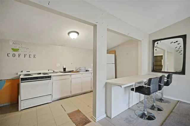 a kitchen with stainless steel appliances granite countertop a sink and cabinets