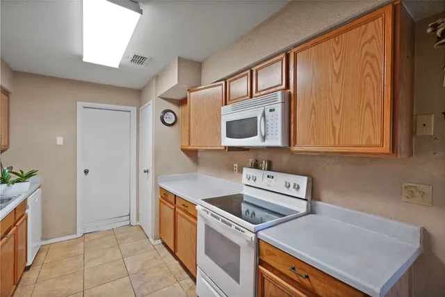 a kitchen with a stove and a microwave