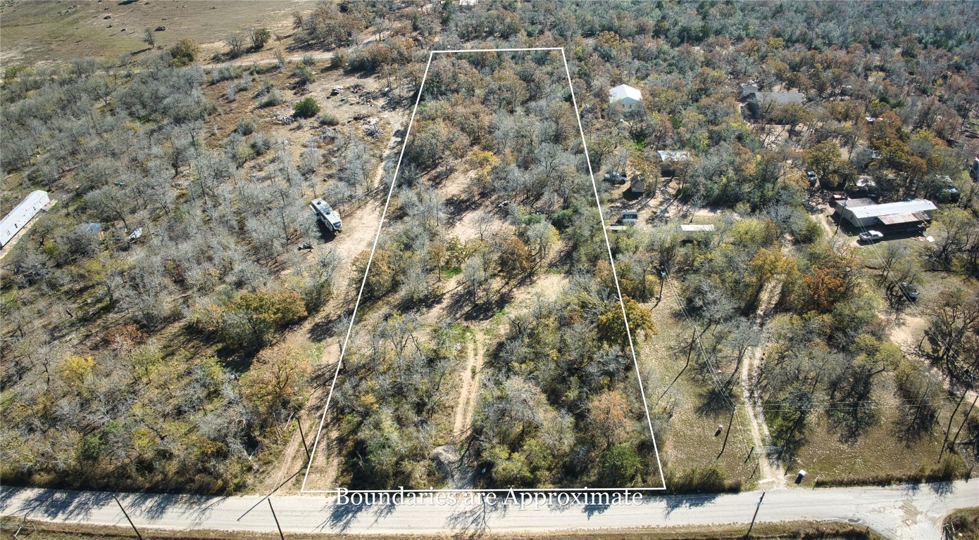 469 Union Hill Road Luling, TX 78648 - Photo 3 of 8 Aerial view of property and surrounding area with property boundaries highlighted and rural landscape